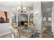 Bright dining room featuring a farmhouse table, stylish lighting, and decor at 3132 Mango Tree Dr, Edgewater, FL 32141