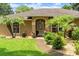 Charming single-story home with well-maintained landscaping, mature trees, and welcoming entrance at 3132 Mango Tree Dr, Edgewater, FL 32141