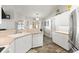 Bright kitchen featuring white cabinets, stainless steel appliances, and a functional design at 3132 Mango Tree Dr, Edgewater, FL 32141
