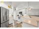 Well-lit kitchen with white cabinetry, modern appliances, and functional layout at 3132 Mango Tree Dr, Edgewater, FL 32141