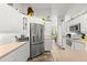 Charming kitchen with white cabinets, stainless steel appliances, and ample counter space at 3132 Mango Tree Dr, Edgewater, FL 32141
