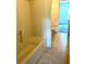 Standard bathroom showing the shower-tub combination, tile floor, and open doorway at 3155 Mapleshade St, Deltona, FL 32738