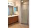 Bathroom with walk-in shower, spacious counter, and ample lighting at 3155 Mapleshade St, Deltona, FL 32738