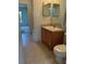 Standard bathroom with tile floor, vanity with double mirror and toilet at 3155 Mapleshade St, Deltona, FL 32738