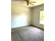 Bedroom featuring neutral carpet and a ceiling fan at 3155 Mapleshade St, Deltona, FL 32738
