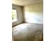 A plain bedroom with a window and carpeted floor in need of cleaning at 3155 Mapleshade St, Deltona, FL 32738
