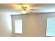 Bedroom features a ceiling fan, and natural light from windows at 3155 Mapleshade St, Deltona, FL 32738