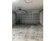 The garage shows a garage door, a trash can, and a concrete floor at 3155 Mapleshade St, Deltona, FL 32738