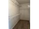 Walk-in closet with wire shelving for ample storage at 3155 Mapleshade St, Deltona, FL 32738