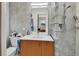 Modern bathroom with sleek vanity, glass block shower, and stylish tile work, offers a spa-like retreat at 319 N Salisbury Ave, Deland, FL 32720