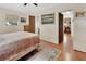 Comfortable bedroom with hardwood floors, bright natural light, and ensuite bathroom access at 319 N Salisbury Ave, Deland, FL 32720