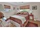 Cozy bedroom showcasing hardwood floors, natural light, and classic decor at 319 N Salisbury Ave, Deland, FL 32720