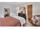 Bedroom features built-ins, dresser and chair with bright natural light at 319 N Salisbury Ave, Deland, FL 32720
