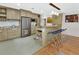 Modern kitchen with stainless steel appliances, granite countertops, and a breakfast bar at 319 N Salisbury Ave, Deland, FL 32720