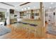 Open kitchen with bar seating, light wood cabinets, and wood floors; great for entertaining at 319 N Salisbury Ave, Deland, FL 32720