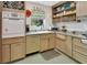Bright kitchen showcasing updated countertops, cabinetry, and unique vintage appliance at 319 N Salisbury Ave, Deland, FL 32720