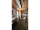 Functional laundry room with washer, dryer, sink, and wood paneled ceiling at 319 N Salisbury Ave, Deland, FL 32720