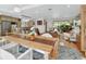 Open-concept living area with seamless flow between the dining room, living room, and kitchen at 319 N Salisbury Ave, Deland, FL 32720