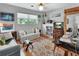 Cozy living room featuring a comfortable sofa, a desk, hardwood floors, and bright natural light at 319 N Salisbury Ave, Deland, FL 32720