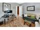 Cozy living room featuring a comfortable couch, workspace, and stylish decor at 319 N Salisbury Ave, Deland, FL 32720