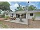 Outdoor patio featuring modern furniture with glass door access to the main house at 319 N Salisbury Ave, Deland, FL 32720