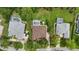 Aerial view of multiple homes with private pools, landscaped yards, and well-maintained exteriors at 33 Coquina Ridge Way, Ormond Beach, FL 32174