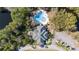 Aerial view showcasing community pool, clubhouse, ample parking, and landscaped grounds at 33 Coquina Ridge Way, Ormond Beach, FL 32174