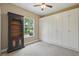 Neutral-colored bedroom with built-in storage and large window at 33 Coquina Ridge Way, Ormond Beach, FL 32174