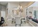 Cozy dining area with elegant lighting, seamlessly connected to living spaces, perfect for intimate gatherings and meals at 33 Coquina Ridge Way, Ormond Beach, FL 32174