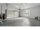 Spacious garage with a garage door and room for multiple cars at 33 Coquina Ridge Way, Ormond Beach, FL 32174