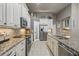 Well-equipped kitchen with stainless steel appliances, granite countertops, and ample cabinet space for storage and style at 33 Coquina Ridge Way, Ormond Beach, FL 32174