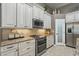 Charming kitchen showing granite counters, stainless appliances and custom cabinets provides both beauty and functionality at 33 Coquina Ridge Way, Ormond Beach, FL 32174