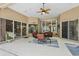 Large covered patio with comfortable seating and views of the backyard at 33 Coquina Ridge Way, Ormond Beach, FL 32174