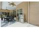 Lanai with a grill and dining area, overlooking the backyard and a pool area at 33 Coquina Ridge Way, Ormond Beach, FL 32174
