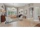 Spacious living room with tile flooring, elegant furniture, and a view of the outdoor pool at 33 Coquina Ridge Way, Ormond Beach, FL 32174