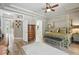 This luxurious main bedroom boasts hardwood floors, ensuite access, and a sitting area with natural light at 33 Coquina Ridge Way, Ormond Beach, FL 32174