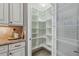 Organized walk-in pantry with ample shelving and storage space for kitchen essentials and culinary supplies at 33 Coquina Ridge Way, Ormond Beach, FL 32174