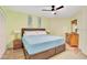 Serene bedroom with ample closet space, a ceiling fan, and bedside tables with lamps at 3647 S Atlantic Ave # 7C, Daytona Beach, FL 32118