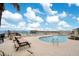 Outdoor pool and sundeck with plenty of lounging chairs by the ocean at 3647 S Atlantic Ave # 7C, Daytona Beach, FL 32118