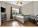Cozy bedroom with a twin bed, natural light, and an entertainment setup, perfect for relaxation at 3671 Plantation Dr, Ormond Beach, FL 32174