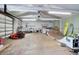 Large garage interior with a ramp, offering versatile space for hobbies and equipment storage at 3671 Plantation Dr, Ormond Beach, FL 32174