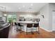 Open kitchen with large island, stainless steel appliances, and eat-in dining space at 3671 Plantation Dr, Ormond Beach, FL 32174
