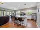 Open kitchen with large island, stainless steel appliances, and eat-in dining space at 3671 Plantation Dr, Ormond Beach, FL 32174