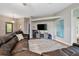 Comfortable living room with plush seating, a large TV, and neutral decor at 3671 Plantation Dr, Ormond Beach, FL 32174