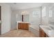 Bright bathroom featuring double vanity, walk-in shower, and relaxing soaking tub at 3839 Calliope Ave, Port Orange, FL 32129