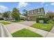 Charming curb appeal with brick driveway leading to a two-story home with well-maintained landscaping at 3839 Calliope Ave, Port Orange, FL 32129