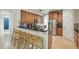 The kitchen features a breakfast bar, stainless steel appliances and wood cabinets at 3839 Calliope Ave, Port Orange, FL 32129
