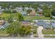 Aerial view of the property featuring a pool and well-maintained lawn within a quiet residential neighborhood at 4 Brandy Hills Dr, Port Orange, FL 32129