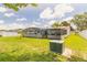 Expansive fenced backyard with a screened pool area, offering privacy and plenty of room to enjoy the outdoors at 4 Brandy Hills Dr, Port Orange, FL 32129