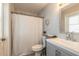 Cozy bathroom featuring tile floors, shower with curtain, and modern vanity at 4 Brandy Hills Dr, Port Orange, FL 32129
